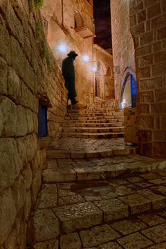 Orthodox Jewish Man Silhouette at Night, Narrow Streets of Old Jaffa - near Tel Aviv, Israel