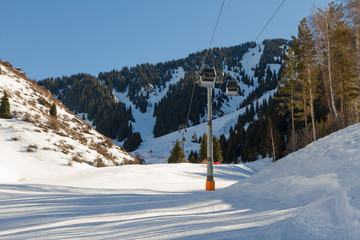 ski trail along the ski lift in the mountains of Tien Shan