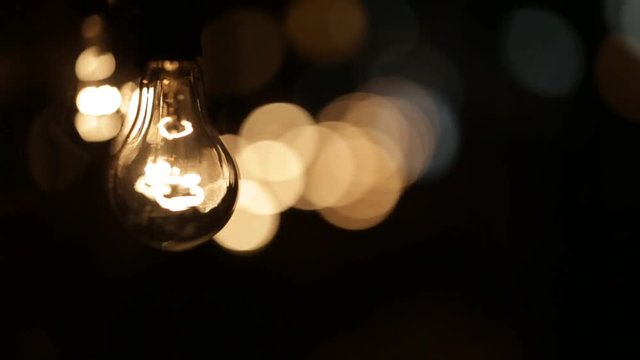 Retro lamps hanging in a row. Focus moves from front to back.