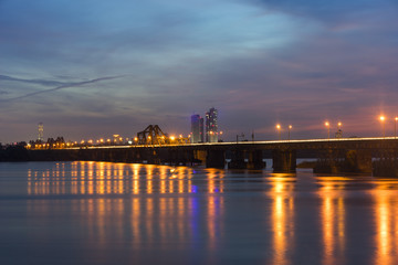 Fototapeta na wymiar Long Bien bridge at sunset. Long Bien Bridge is a historic cantilever bridge across the Red River that connects two districts, Hoan Kiem and Long Bien