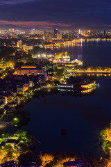 Aerial view of Hanoi skyline at West Lake ( Ho Tay in Vietnamese), at twilight