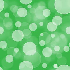 Seamless bokeh wallpaper background. Holiday bokeh background. Green bokeh backdrop. © Pineapples