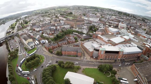 Aerial view of Derry with rooftops and River Foyle