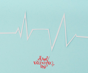 Paper cut of cardiogram of heart rhythm for Valentines Day .