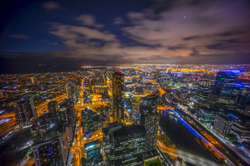 Fototapeta premium Aerial view of dramatic sunset at Melbourne city skyline