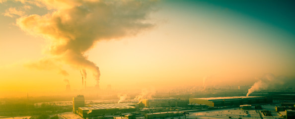 View in thermal power plants. Through the large clouds punched sunlight.

