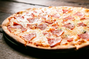 bacon pizza on table