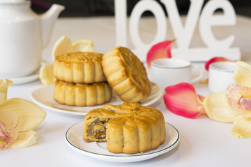 Moon cake, food for Vietnamese mid autumn festival. Focus on moon cake and others are blurred