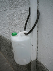 Water Container chained to post