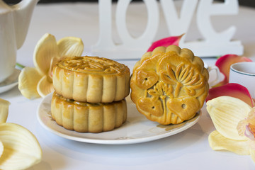 Moon cake, food for Vietnamese mid autumn festival. Focus on moon cake and others are blurred