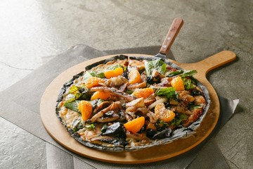 Calamari pizza on table