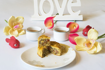 Moon cake, food for Vietnamese mid autumn festival. Focus on moon cake and others are blurred