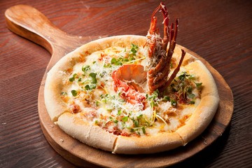 lobster pizza on table