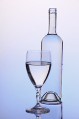 bottle of wine  and a glass 