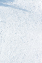 Winter background with snow on the ski field