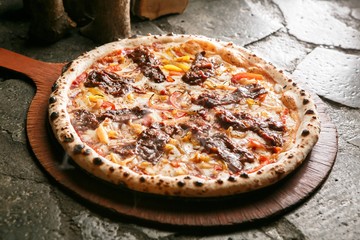 steak pizza on plate