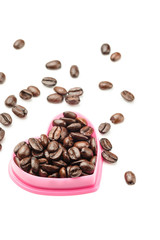 Coffee beans in heart shape isolated on white background