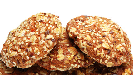 Cookies covered with nuts and raisins isolated on white background