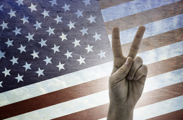 Victory symbol - two fingers on United States of America flag