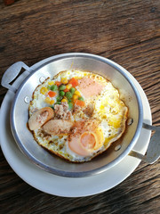 Pan fried egg with pork and toppings