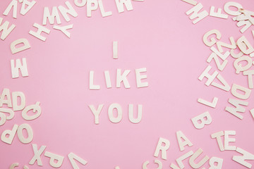 Sorting letters i like you on pink.