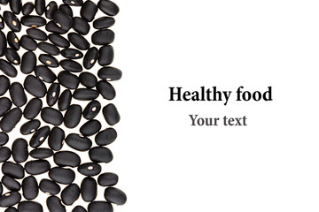 Border of black  kidney beans closeup with copy space on white background. Isolated. Healthy protein food.