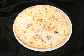 Quattro Formaggi pizza on dish
