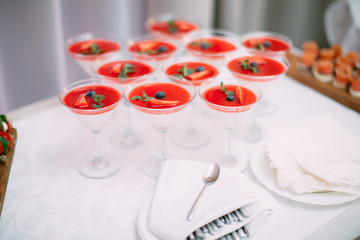 Wedding Party. Red cocktails in glasses ready for party people. Red cocktail at wedding reception.