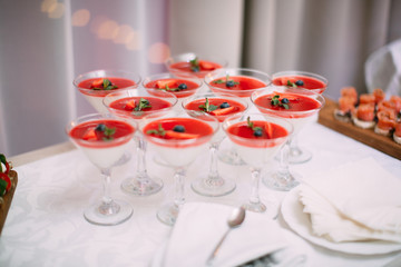 Wedding Party. Red cocktails in glasses ready for party people. Red cocktail at wedding reception.