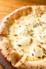 Quattro Formaggi pizza on dish