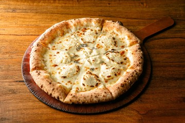 Quattro Formaggi pizza on dish