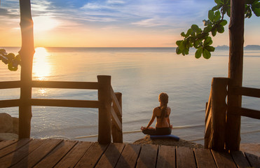 serenity and yoga practicing at sunset,meditation