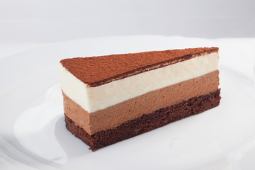 three chocolate cake slice isolated on white background