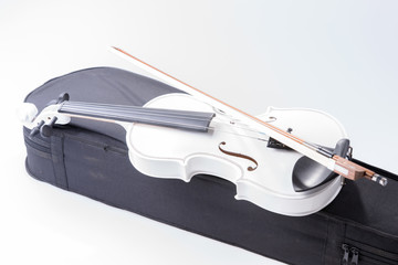 White violin with the bow isolated on white background