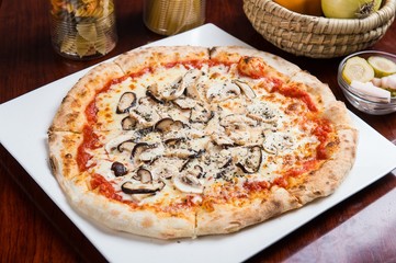 mushroom pizza on table