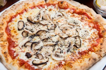 mushroom pizza on table