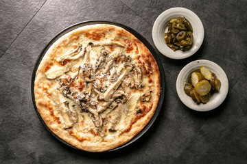 mushroom pizza on table