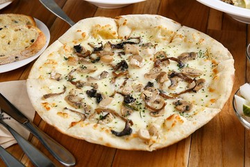 mushroom pizza on table