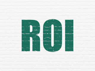 Finance concept: ROI on wall background