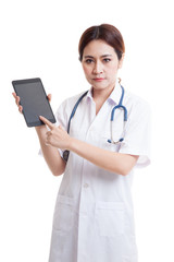 Asian young female doctor touch screen on tablet pc.