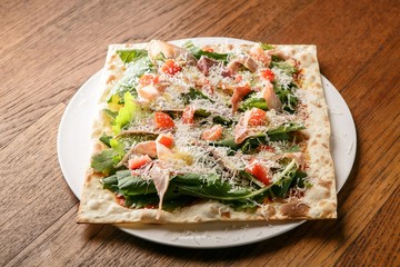 Prosciutto pizza on dish