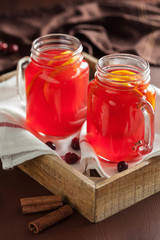 Fototapeta na wymiar hot cranberry tea with orange cinnamon warming drink