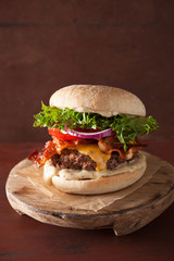 bacon cheese burger with beef patty tomato onion