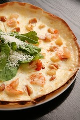 shrimp pizza on table