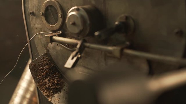 Coffee bean roaster at work in a production room