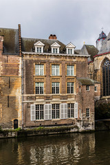 Naklejka premium View of picturesque houses along channel in Ghent. Belgium.