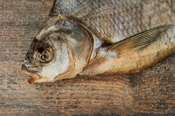 Salty stockfish on wooden table