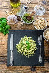 Trofie pasta with vegetarian sauce, pesto with pine nuts and bas