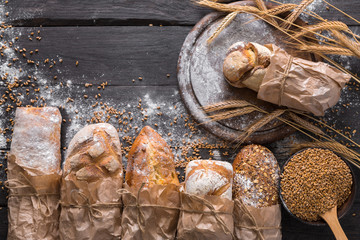 Bread bakery background. Brown and white wheat grain loaves composition