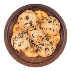 Cookies with peanuts and chocolate in a brown plate. Isolated on
